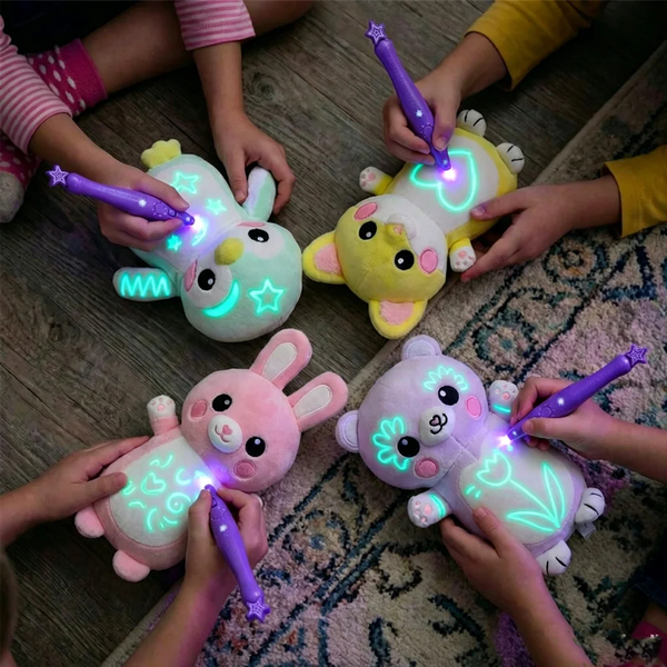 Glow Drawing Plush — a soft animal plush with an included light pen, for drawings that glow in the dark and fade on their own